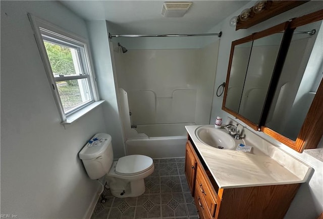 full bathroom with vanity, tile patterned flooring, visible vents, toilet, and washtub / shower combination