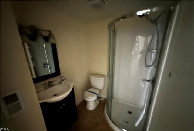 full bath with vanity, toilet, and a stall shower