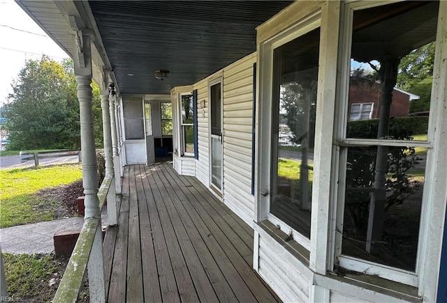 wooden deck featuring covered porch