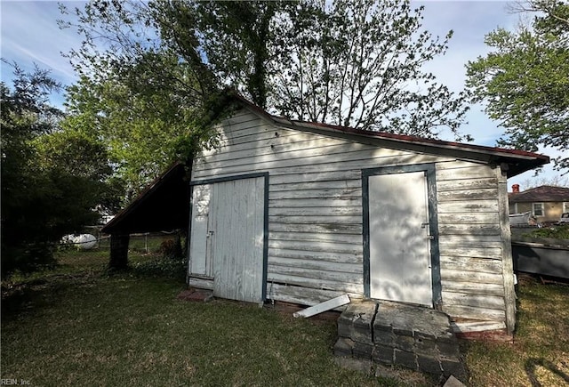 view of shed with fence