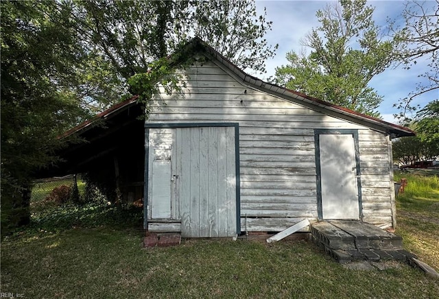 view of shed featuring fence