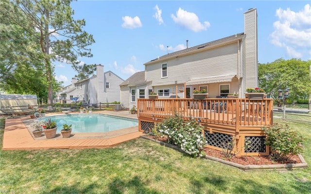 exterior space featuring a yard, a deck, and fence