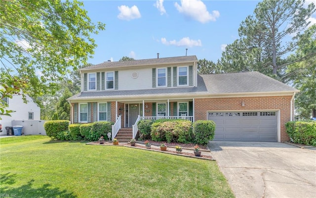 view of front of home with an attached garage, driveway, brick siding, and a porch