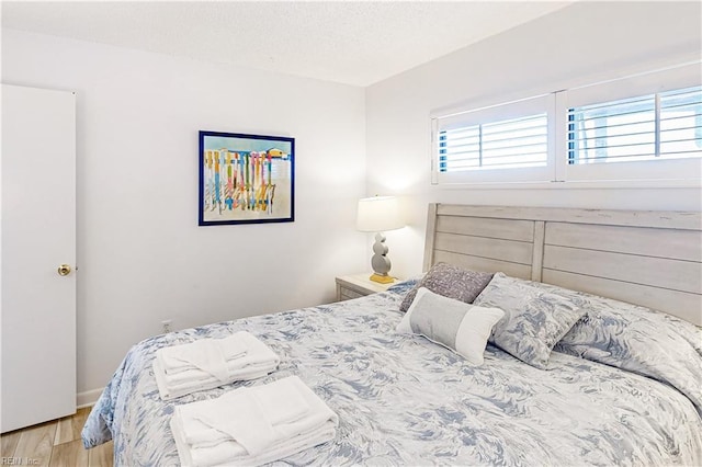 bedroom with wood finished floors