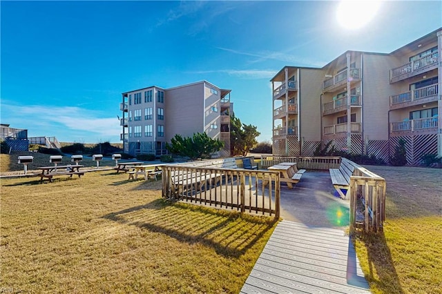 view of property's community with a lawn