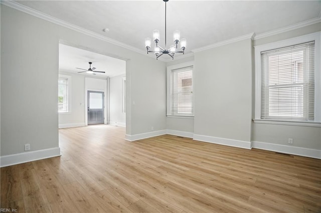 spare room featuring light wood-style floors, ornamental molding, baseboards, and ceiling fan with notable chandelier