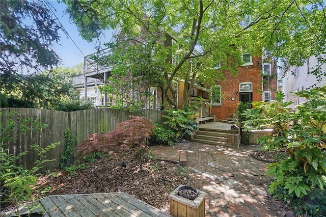 view of yard with a patio and fence