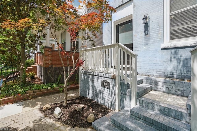 entrance to property with brick siding