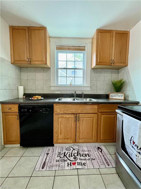 222 Chesterfield Rd, Hampton, VA 23661 - kitchen with dishwasher, a sink, electric range, and light tile patterned flooring