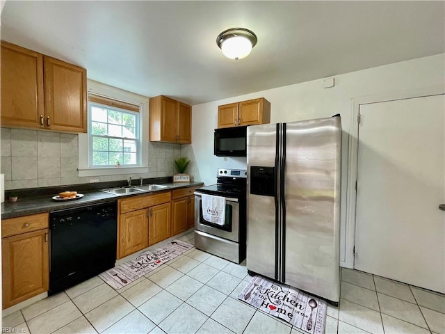 222 Chesterfield Rd, Hampton, VA 23661 - kitchen with black appliances, a sink, dark countertops, decorative backsplash, and brown cabinetry