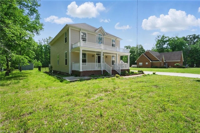 view of front facade with covered porch and a front lawn