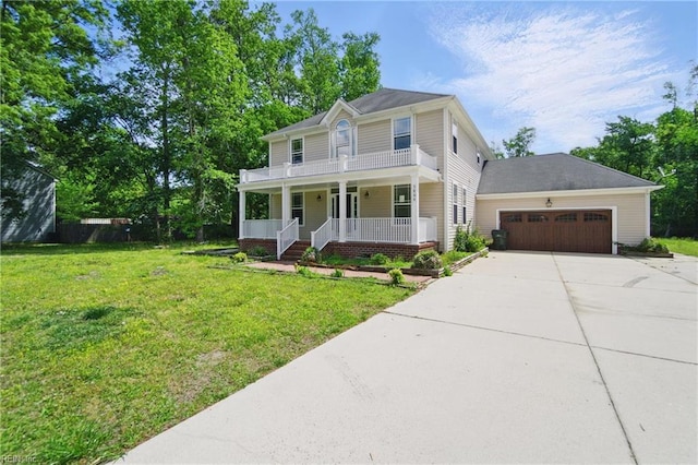 colonial-style house with a garage, a front lawn, covered porch, and driveway