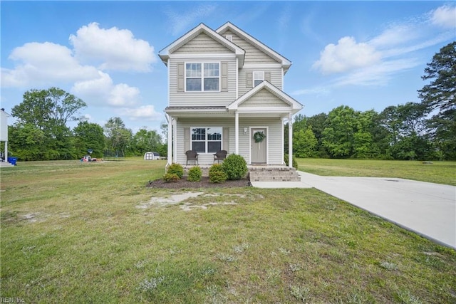 view of front of house with a porch and a front yard