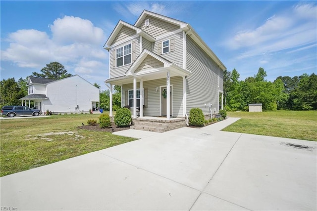 view of front of home featuring covered porch and a front yard