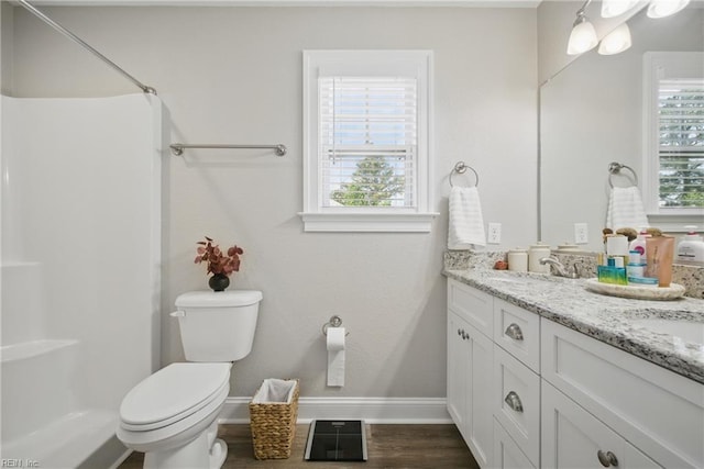 full bath featuring a sink, double vanity, toilet, baseboards, and curtained shower