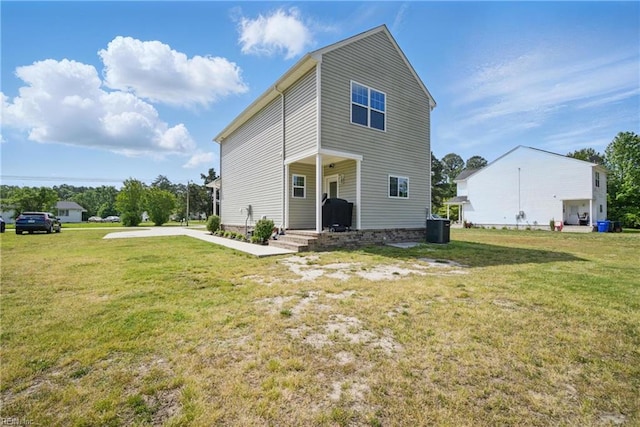 exterior space featuring central AC and a front yard