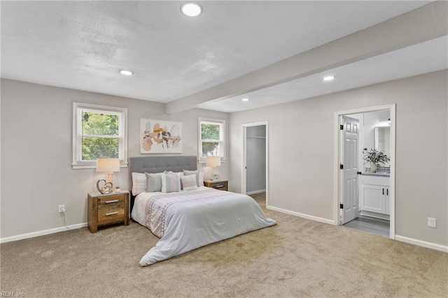 carpeted bedroom featuring recessed lighting, baseboards, and multiple windows