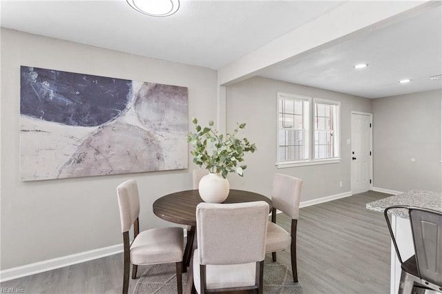 dining space featuring baseboards, recessed lighting, and wood finished floors