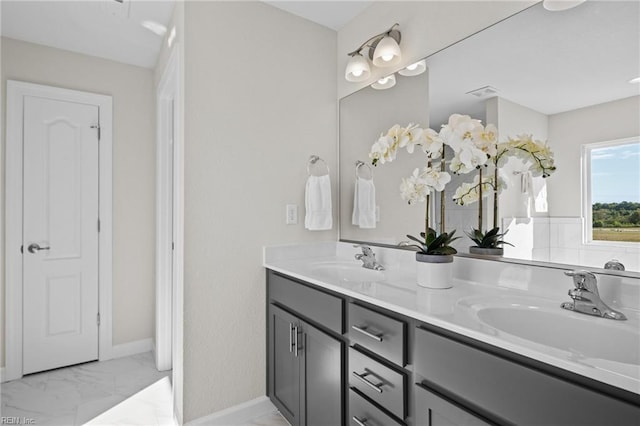 full bathroom featuring a sink, visible vents, double vanity, and marble finish floor