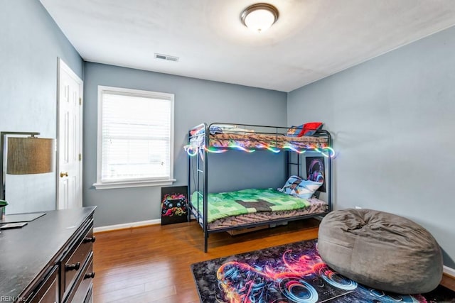 732 Mandarin Ln, Chesapeake, VA 23323 - bedroom with visible vents, baseboards, and wood finished floors