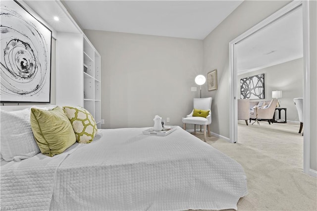 bedroom with baseboards and carpet flooring
