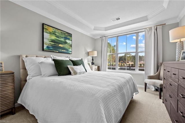 bedroom featuring visible vents, carpet floors, baseboards, a raised ceiling, and ornamental molding
