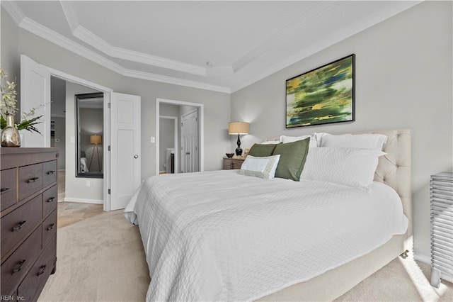 bedroom featuring crown molding, baseboards, light carpet, and a tray ceiling