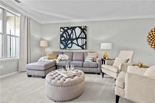 living area with crown molding, baseboards, carpet flooring, and visible vents