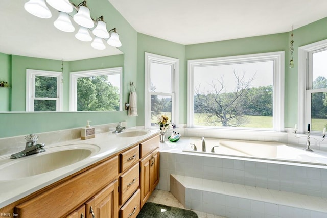 bathroom featuring a sink, plenty of natural light, and a bath