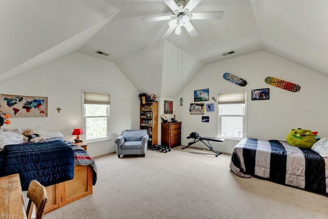 carpeted bedroom with visible vents, a ceiling fan, and vaulted ceiling