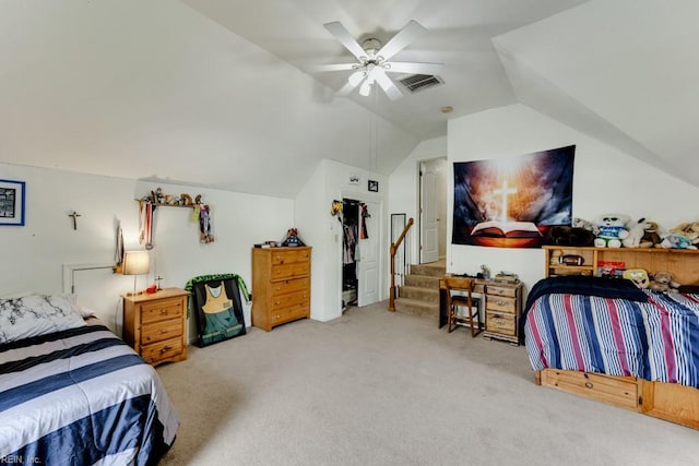 carpeted bedroom featuring ceiling fan, visible vents, and lofted ceiling