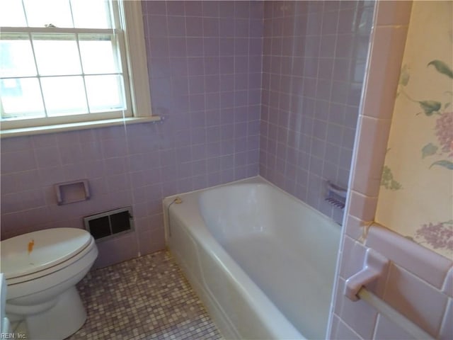 bathroom featuring visible vents, tile patterned flooring, and toilet