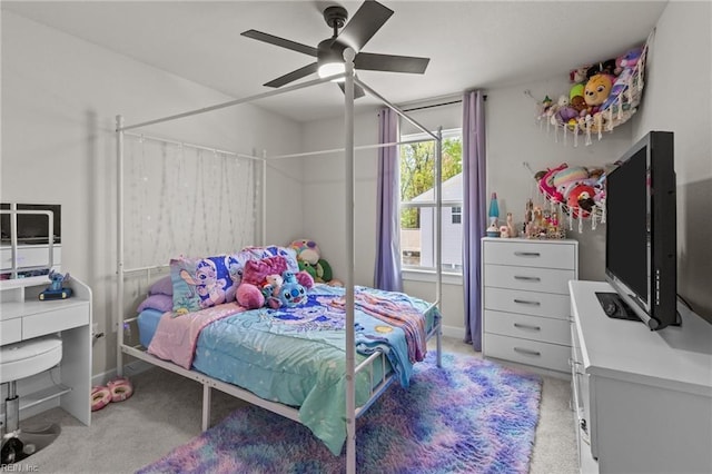 carpeted bedroom with baseboards and ceiling fan