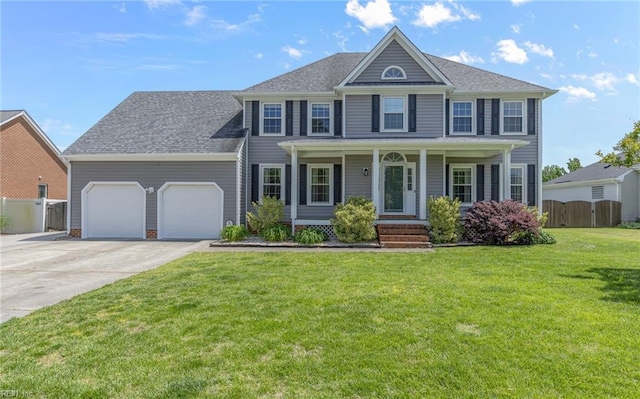 721 Greenwing Dr, Chesapeake, VA 23323 - colonial-style house with a porch, driveway, a front yard, a garage, and fence