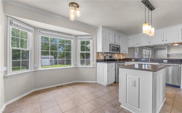 721 Greenwing Dr, Chesapeake, VA 23323 - kitchen with a sink, white cabinetry, appliances with stainless steel finishes, and a wealth of natural light