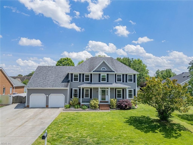 721 Greenwing Dr, Chesapeake, VA 23323 - colonial inspired home featuring fence, an attached garage, a shingled roof, a front yard, and concrete driveway