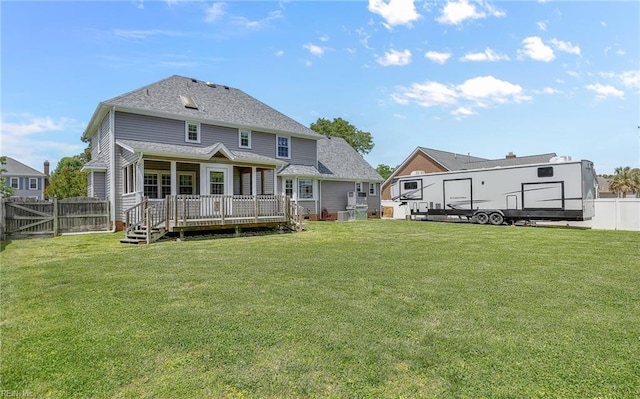 721 Greenwing Dr, Chesapeake, VA 23323 - back of property with a lawn, a deck, and a fenced backyard