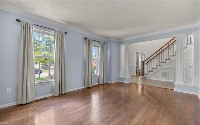 721 Greenwing Dr, Chesapeake, VA 23323 - spare room with ornate columns, visible vents, and hardwood / wood-style flooring