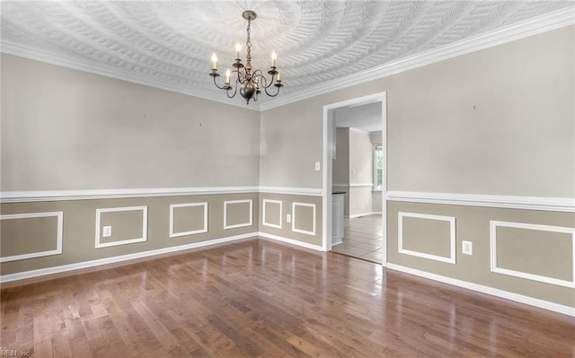 721 Greenwing Dr, Chesapeake, VA 23323 - spare room with crown molding, wainscoting, wood finished floors, and a notable chandelier