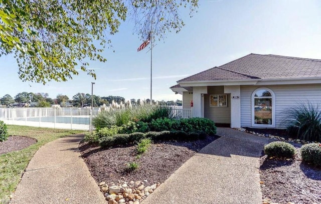 view of front of house with fence