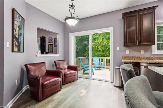 sitting room with light wood finished floors and baseboards