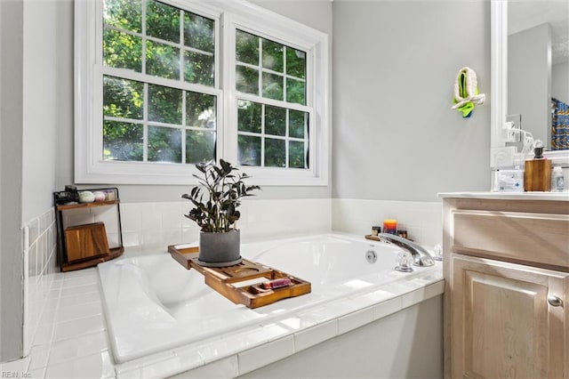 bathroom featuring vanity and a garden tub