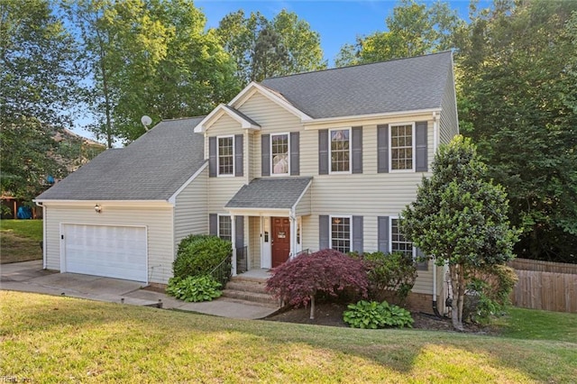 view of front of house with an attached garage, concrete driveway, and a shingled roof