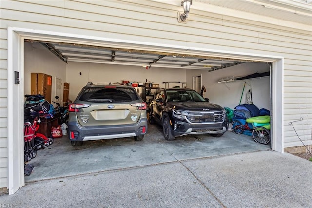 garage with concrete driveway