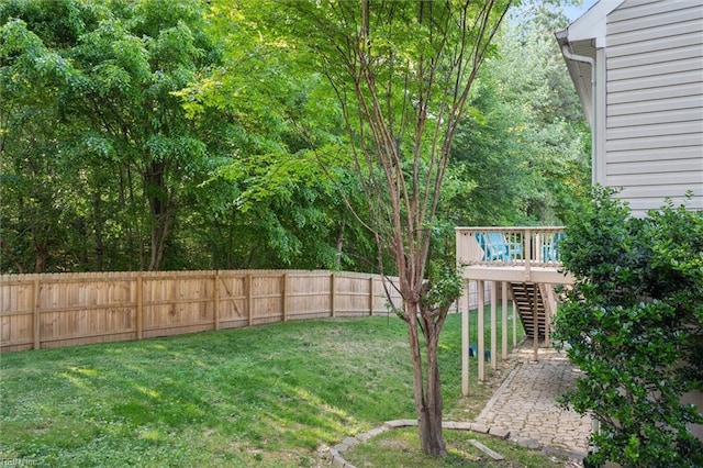 view of yard with stairway and a deck