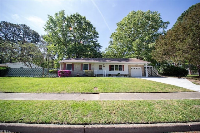 single story home with an attached garage, concrete driveway, fence, and a front yard