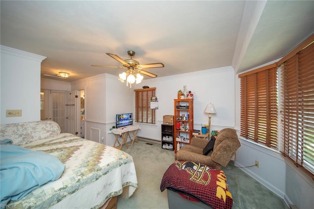 bedroom with carpet, a ceiling fan, and ornamental molding