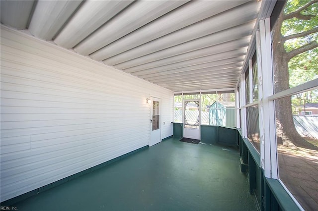 unfurnished sunroom featuring a healthy amount of sunlight