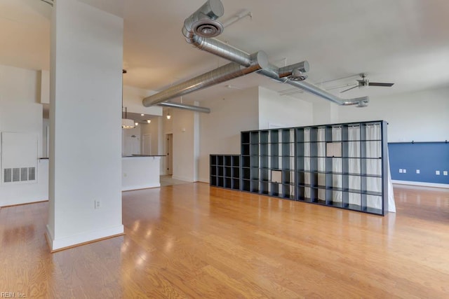spare room with visible vents, baseboards, ceiling fan, and wood finished floors