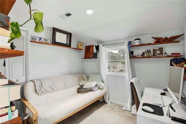 carpeted home office featuring visible vents